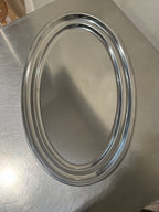 Large oval stainless steel serving tray