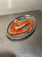 Oval stainless steel serving tray with seafood