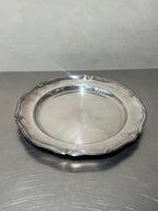 Front view of round silver-plated tray