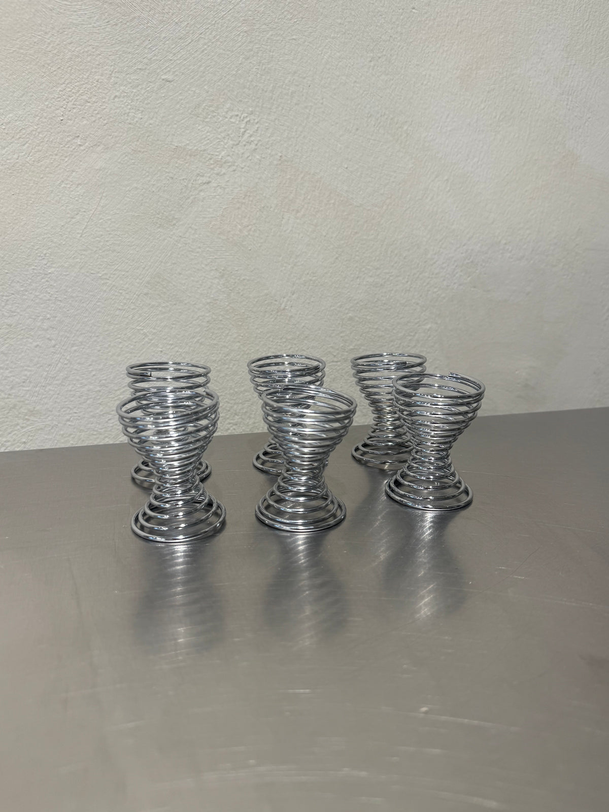 Set of six spiral egg cups in chrome