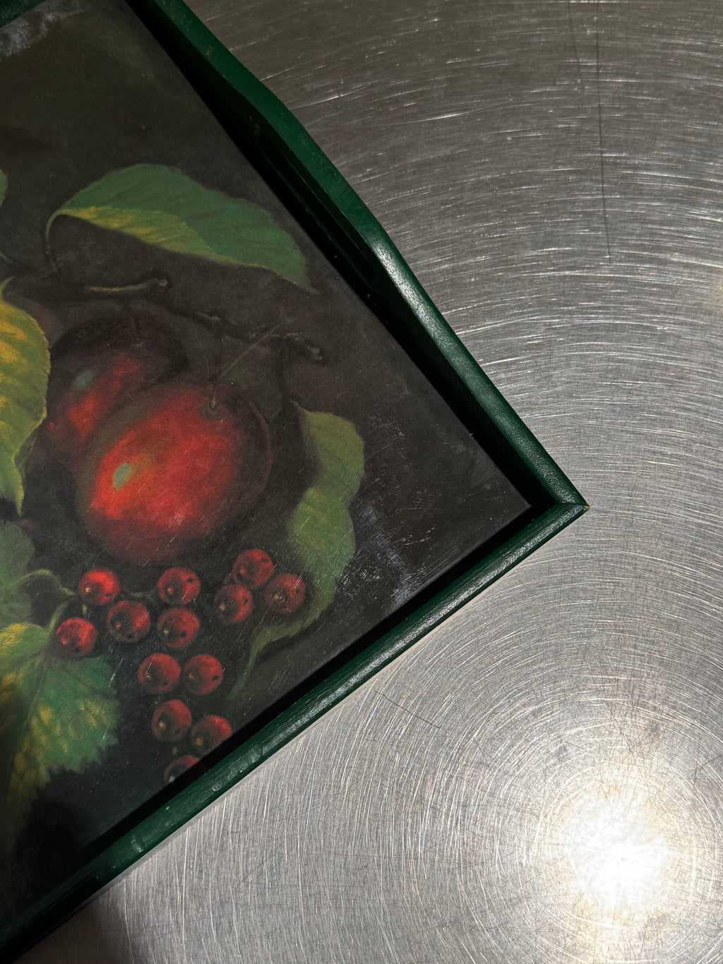 Detail of fruit motif and vintage wear