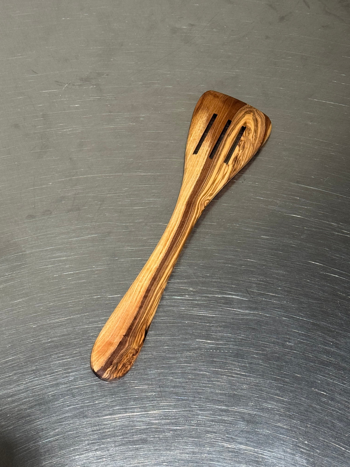 Olive wood slotted spatula