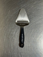 Microplane cheese slicer in black and stainless steel