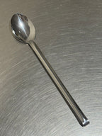Tomatto serveringssked i rostfritt stål framifrån