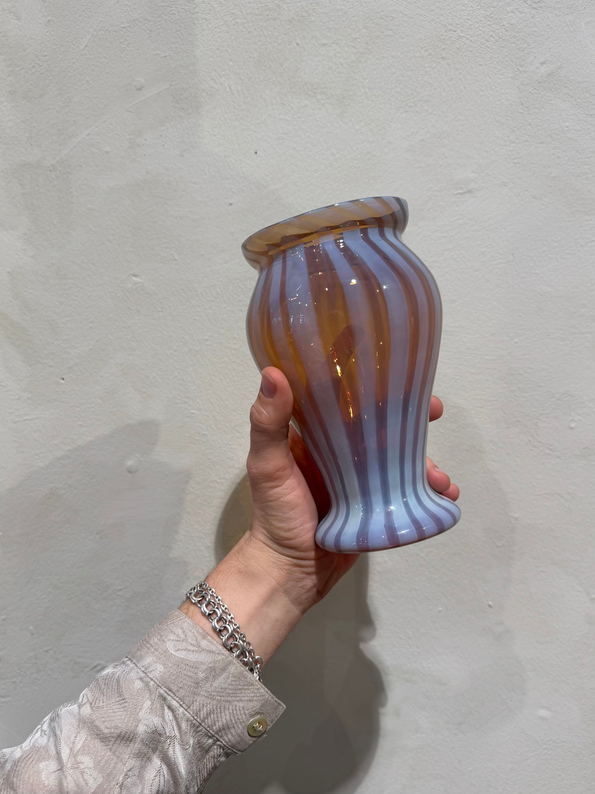 Striped amber and milk-white glass vase