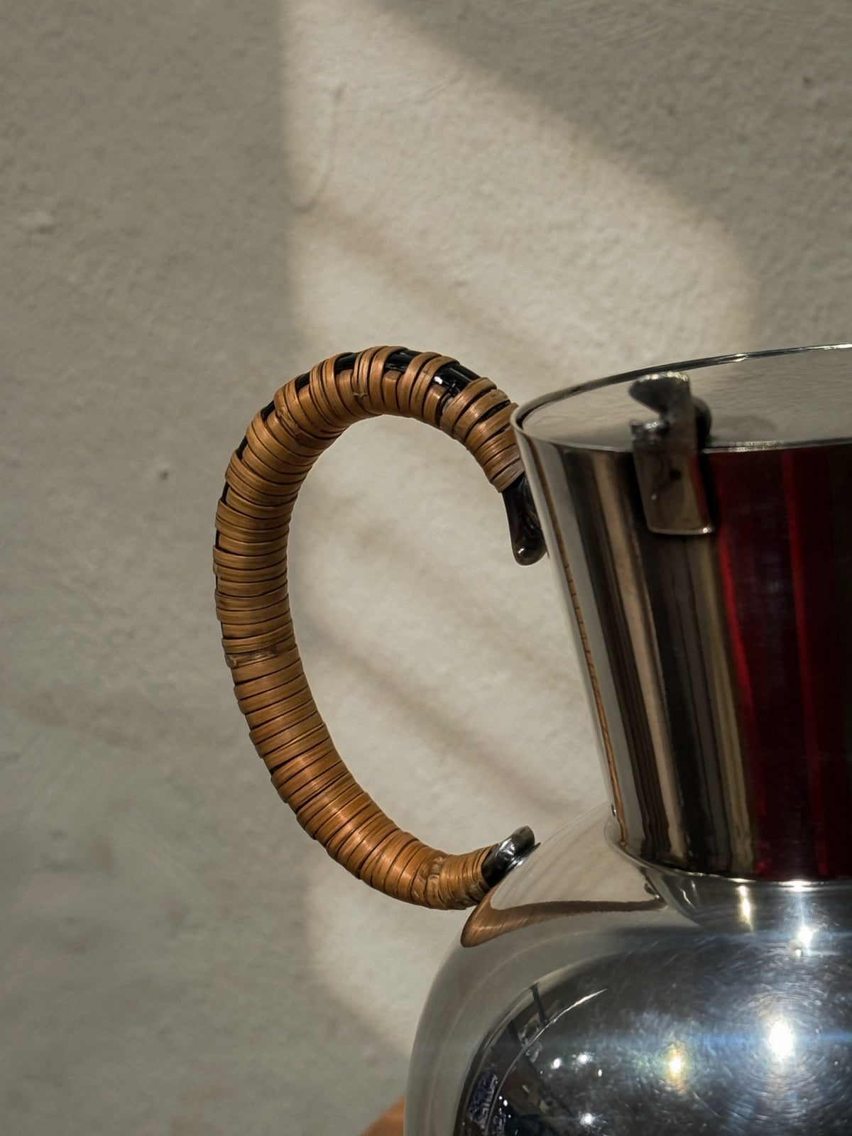 Rattan handle detail on WMF nickel silver pitcher