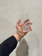 2000s tumbler with frosted foot held in hand