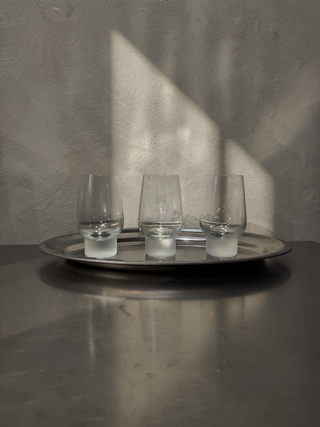 Three 2000s tumblers with frosted glass feet