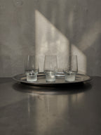 Three 2000s tumblers with frosted glass feet